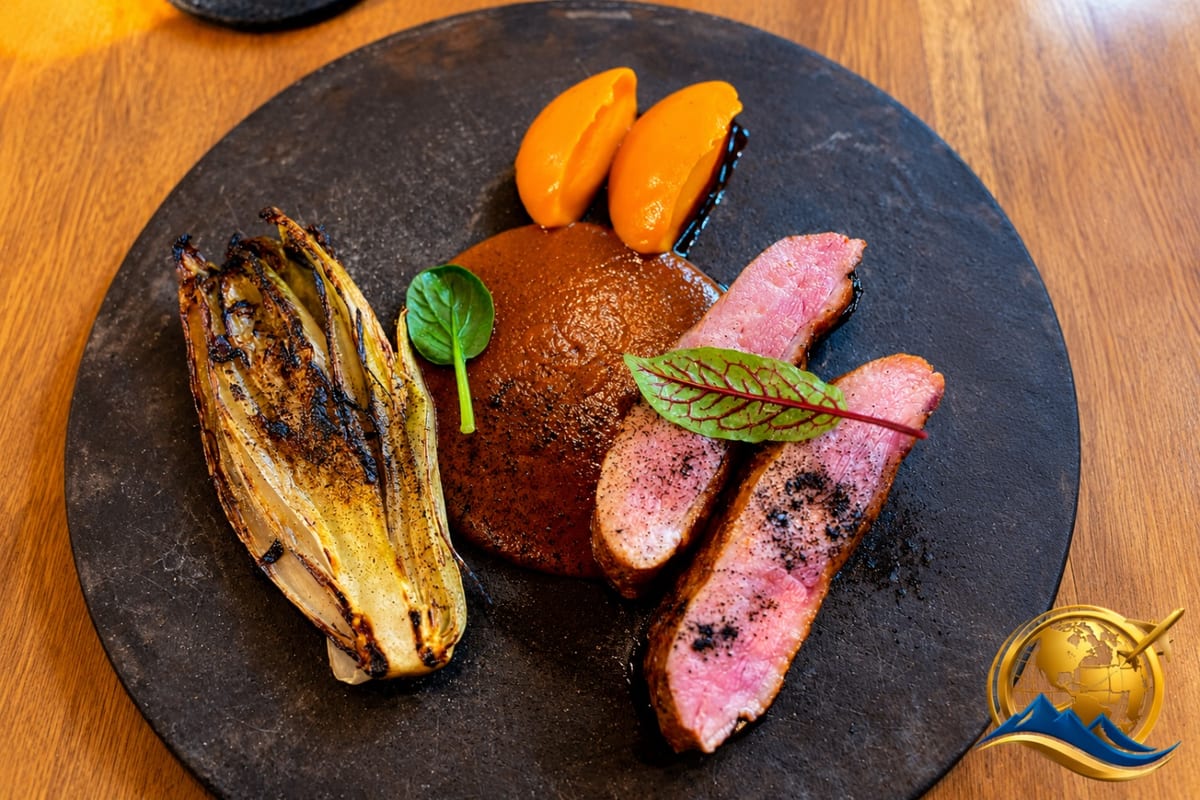 A plated tasting-menu dish at Sud 777